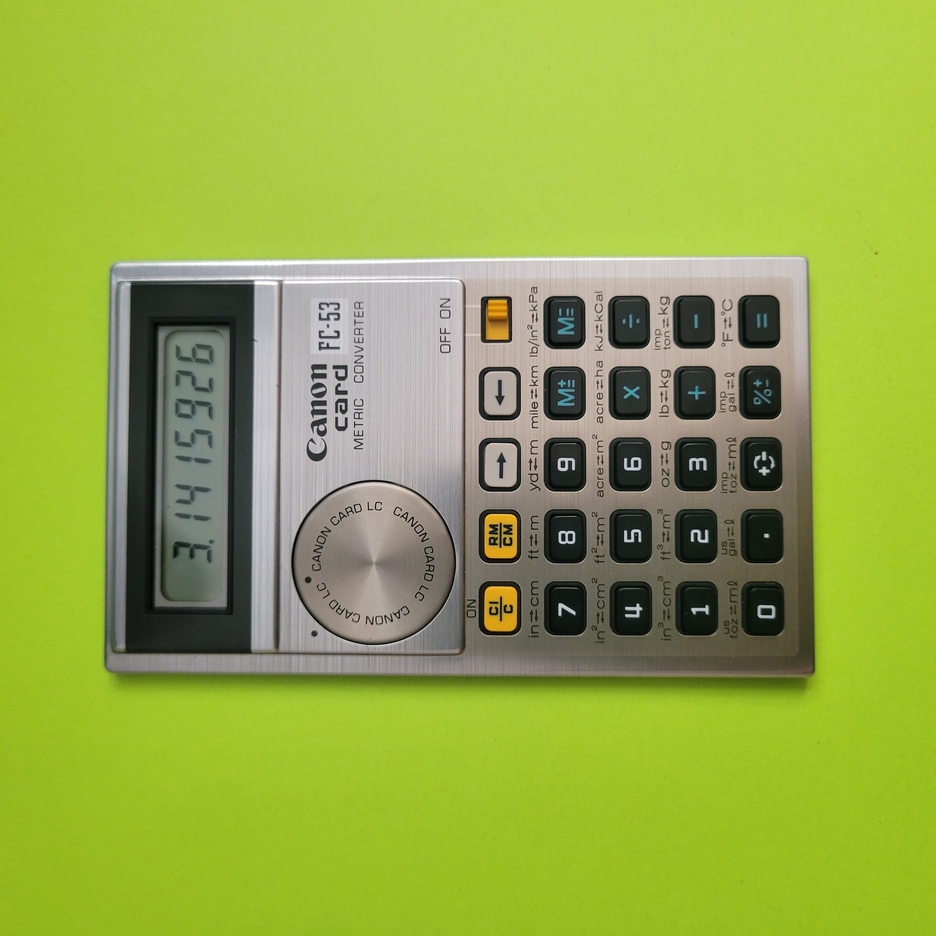 an image of a canon card FC-53 Metric Converter calculator